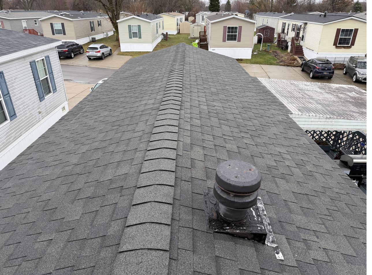 Repaired roof, ridge cap and vent boot sealed