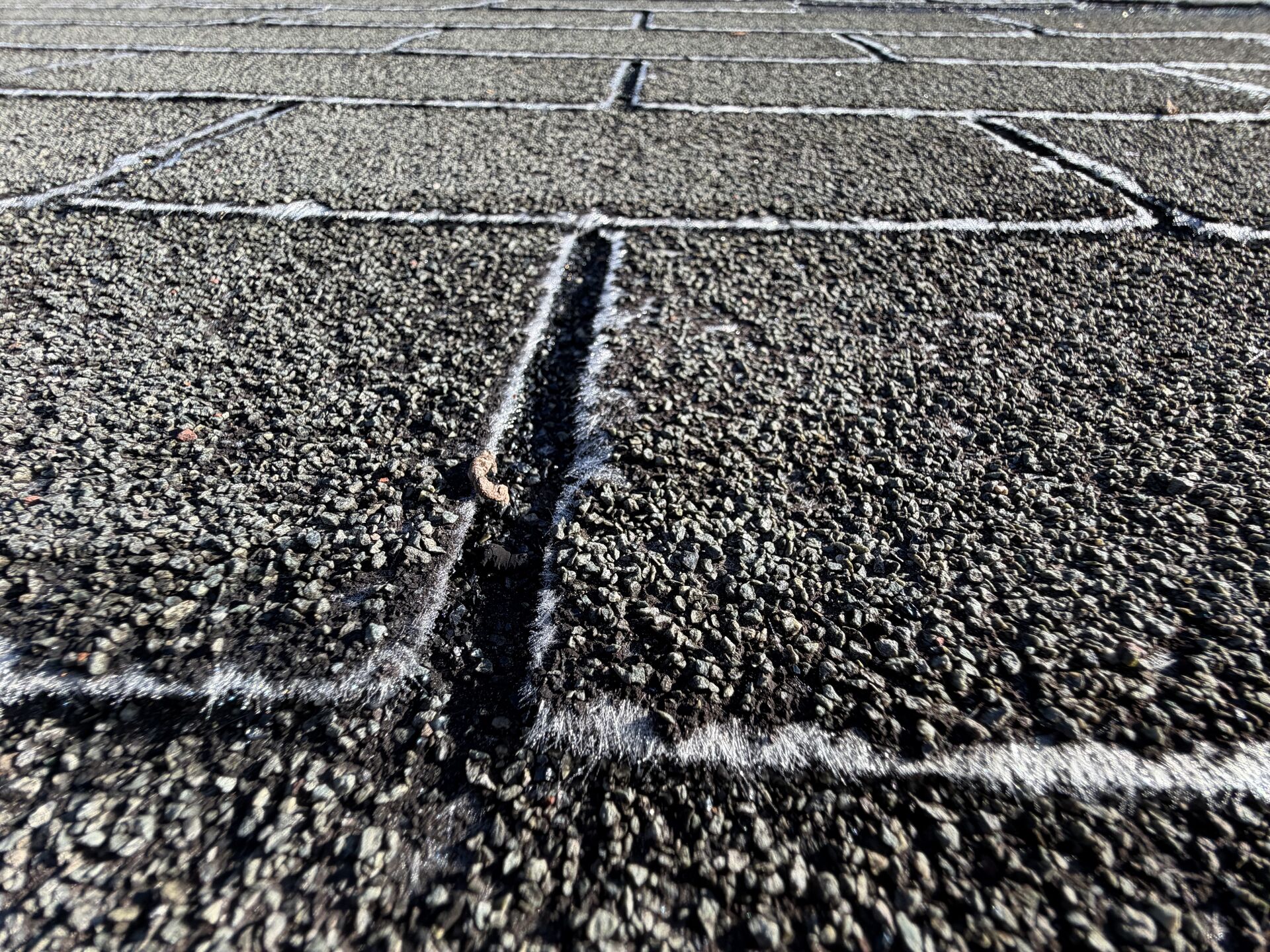 Before: Worn shingle course replaced with architectural dimensional shingle